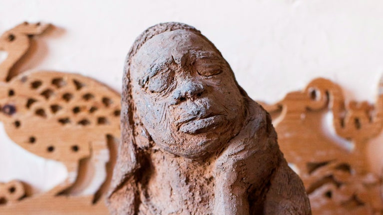 Close-up of a statue of a figure as African artwork in the collection of 575 Wandsworth Road, London